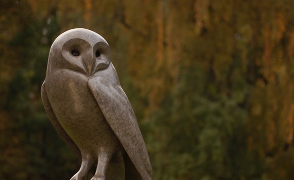 Bronze Barn Owl resting sculpture